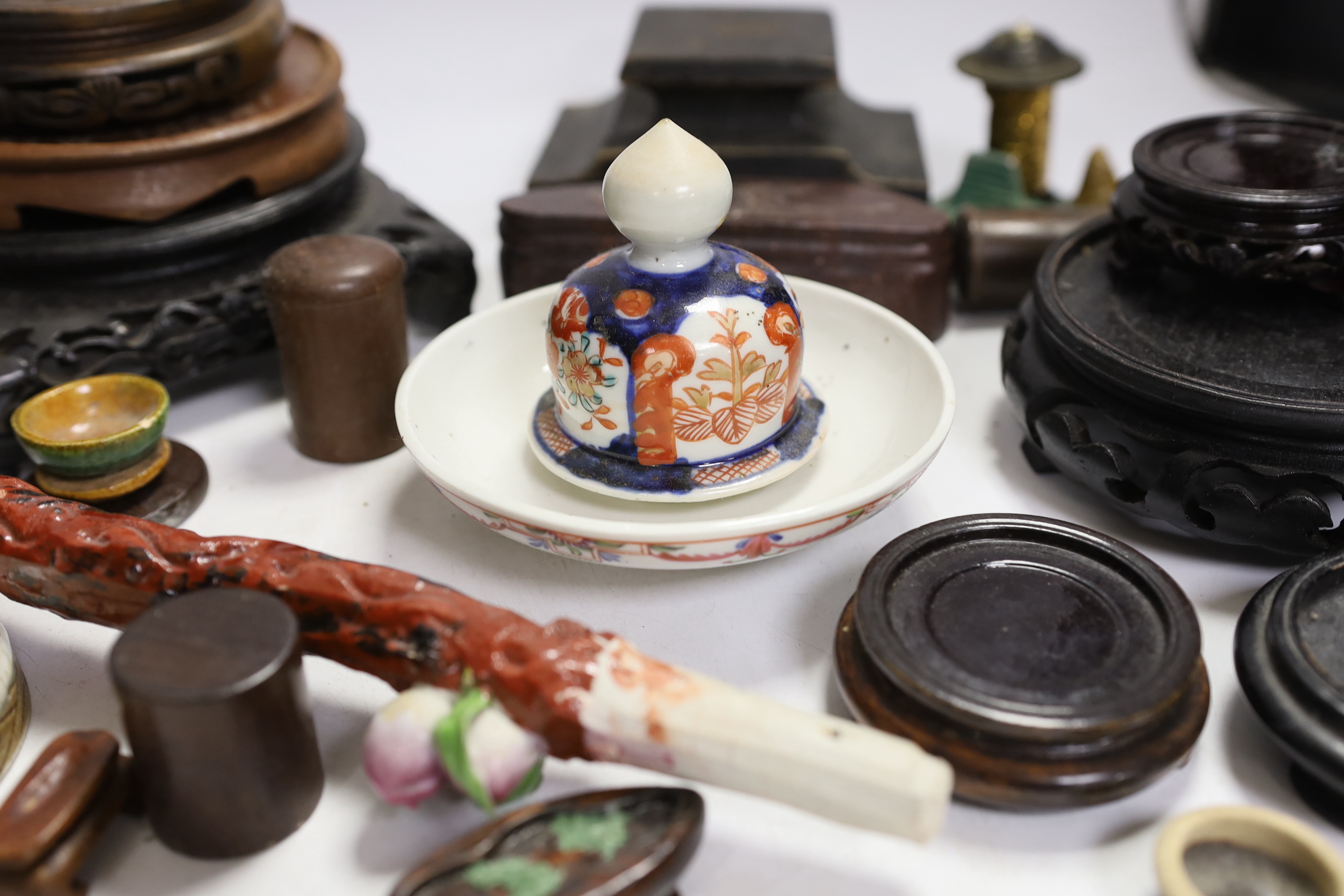 A collection of mixed Chinese wooden stands, a ceramic dragon head and miscellaneous ceramics